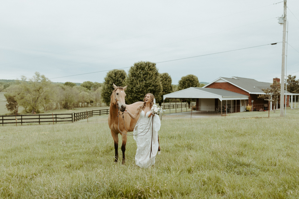 Jessi and her horse on her western wedding day in murfeesboro