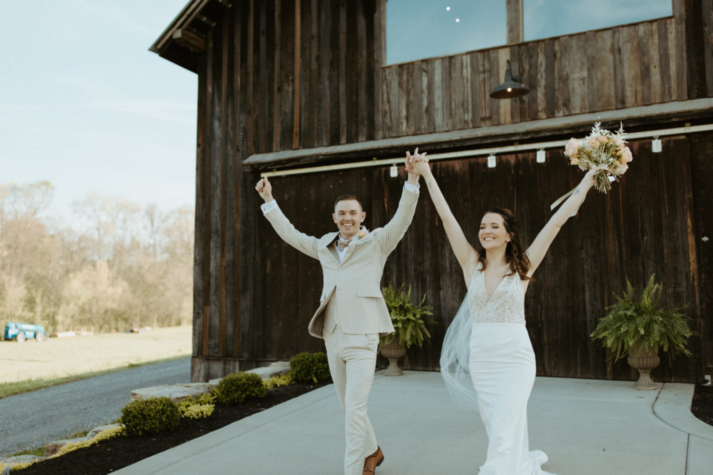 Couple walking out of L & L farm a wedding venue in Nashville