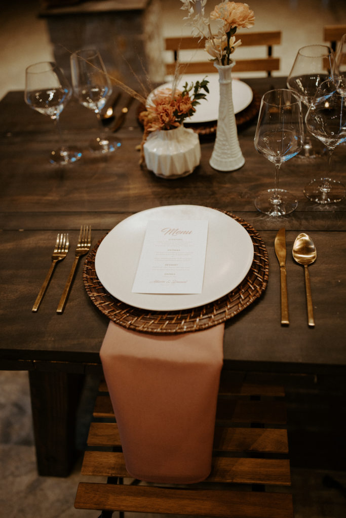 A lovely table setup with a beautifully crafted wedding menu.