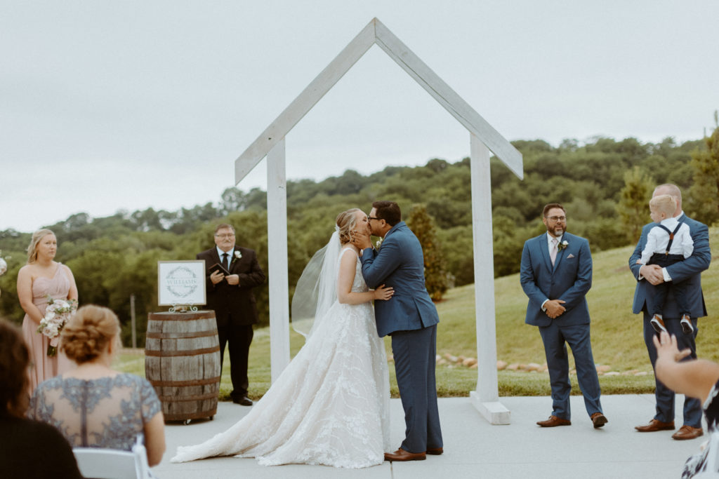 Amanda and Cody celebrating a first kiss at their Tennessee wedding venue Cranford Hollow.