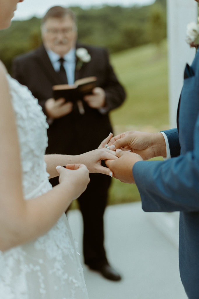 Exchanging rings during their ceremony during the wedding at Cranford Hollow in Columbia, Tennessee