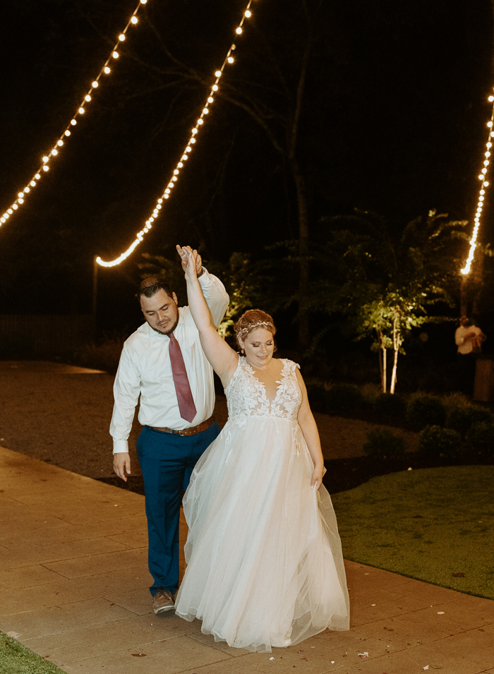 Juan and Rachel dancing outside the barn at firefly lane wedding and events venue. 