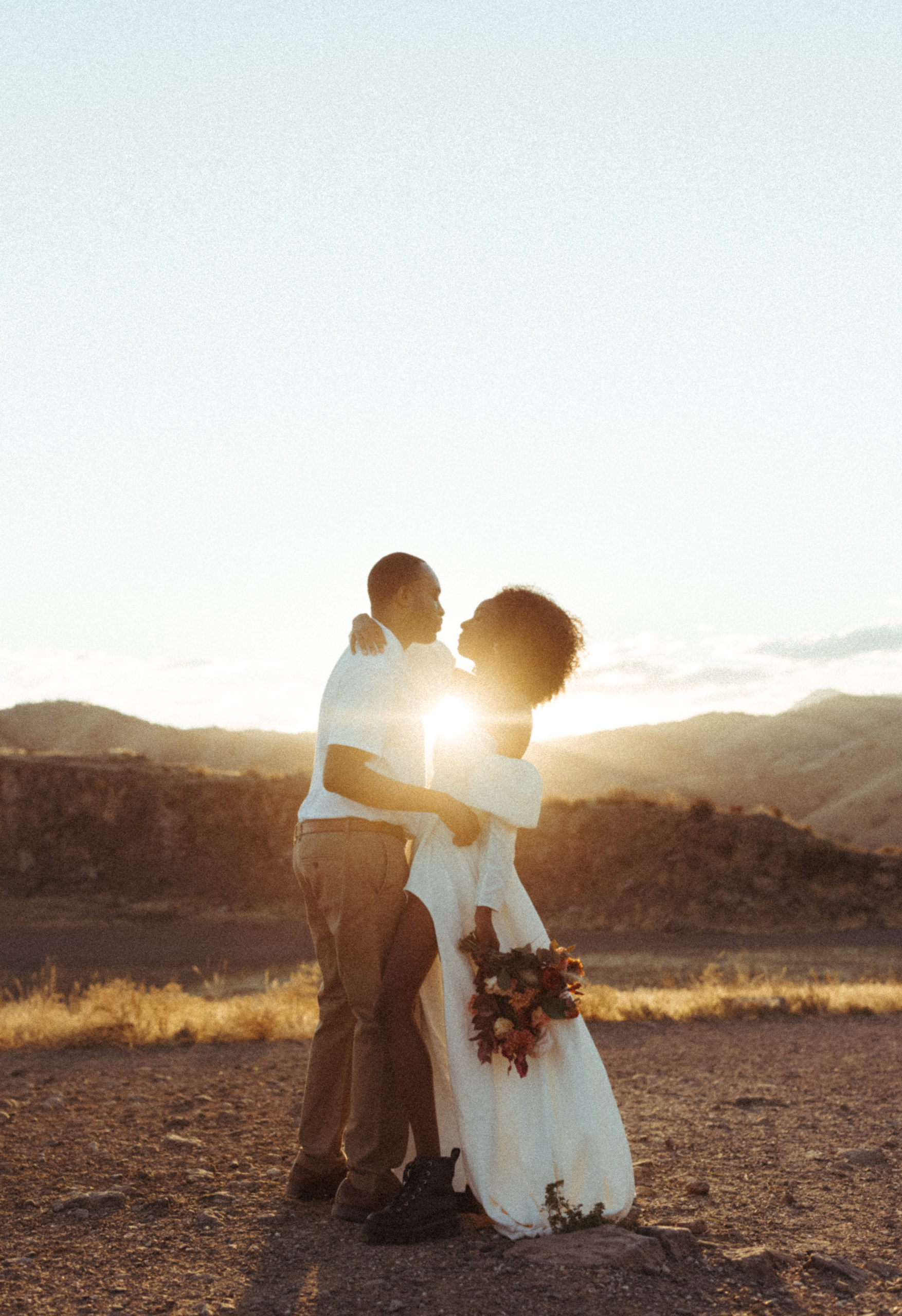 Film like portrait of GG and Tray on The North Table Mountain Trail during their Colorado Elopement. 