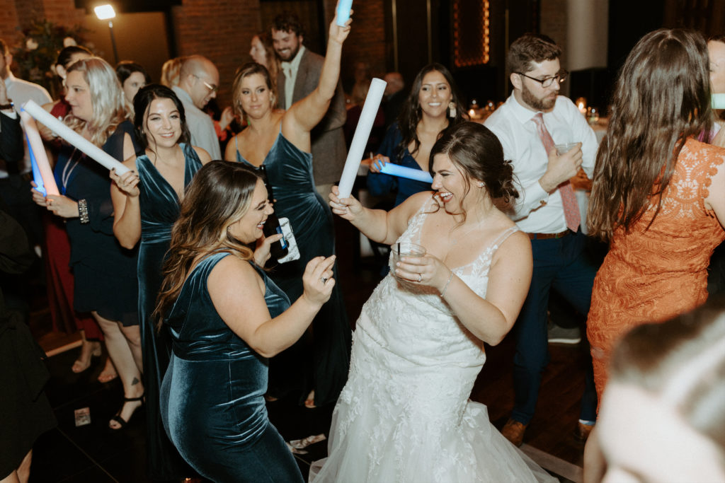 Marissa dancing with one of her bridesmaids at her wedding reception at Clementine Hall.
