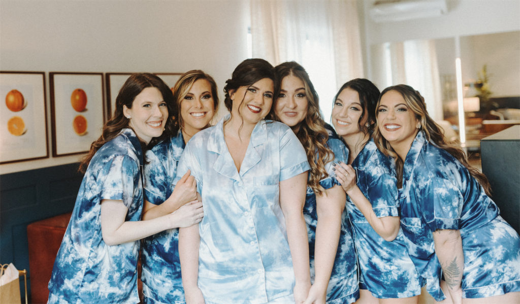 Marissa and her bridesmaids in robes during her fall wedding at Clementine Hall. 