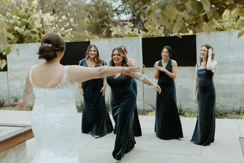 Marissa's bridesmaids seeing her for the first time on her wedding day.