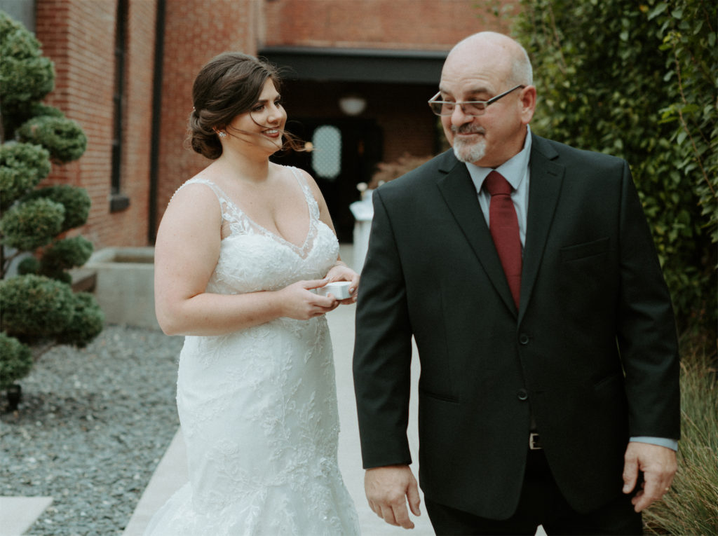 Marissa and her dads first look during her fall wedding at clementine hall.