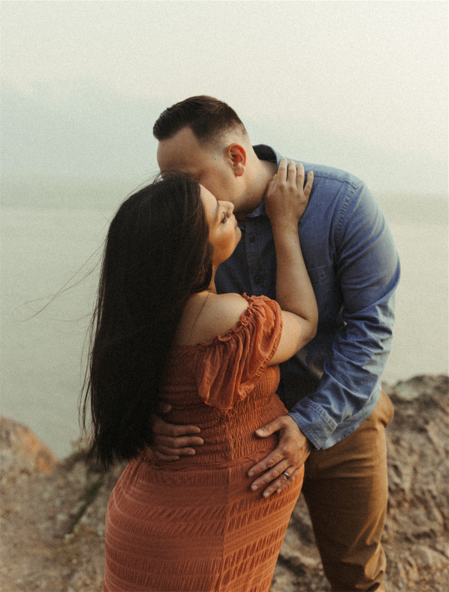 Couple holding eachother close during photos at Beluga point