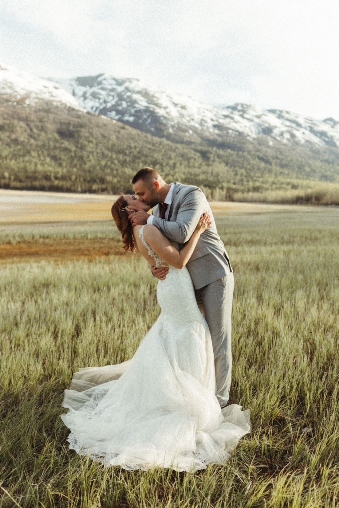 couple embracing during their anniversary photo session at Eklutna Lake