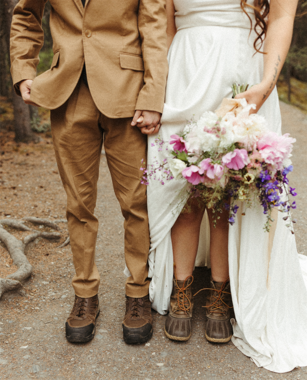 Couple in hiking boots during their Alaska elopement