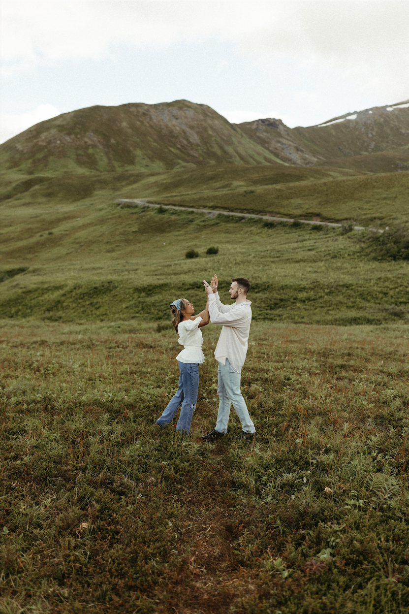 Couple holding hands during session at Hatcher Pass in Alaska