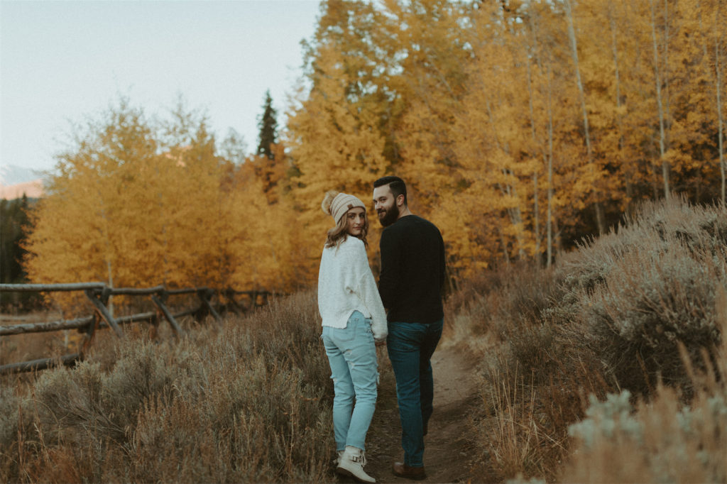 Couple walking during their engagement session in Breckenridge, Colorado