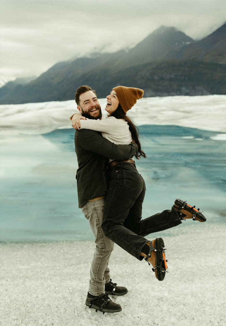 Couple laughing together during their Alaska helicopter tour