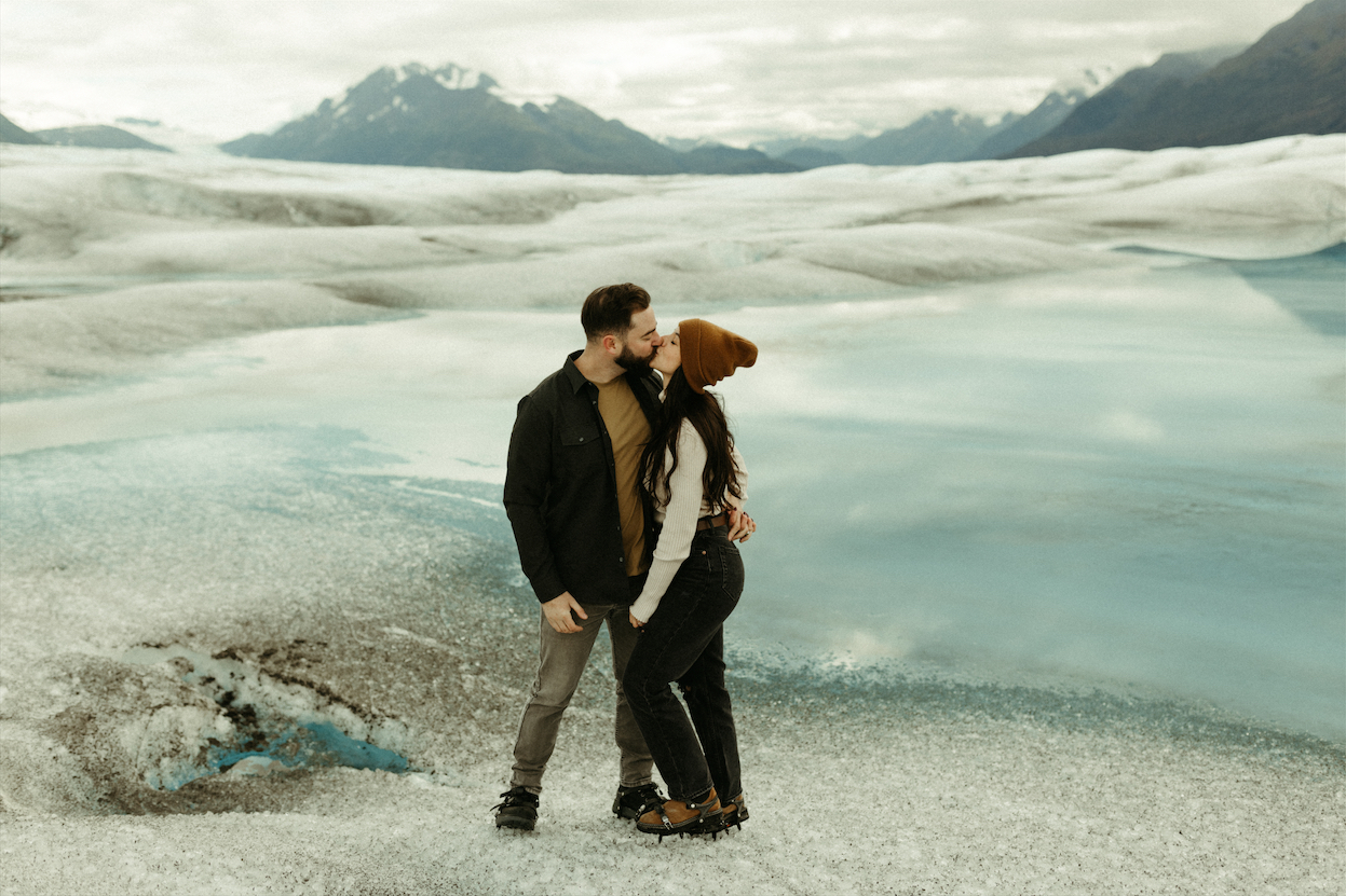 Couple kissing during their session at Knik Glacier