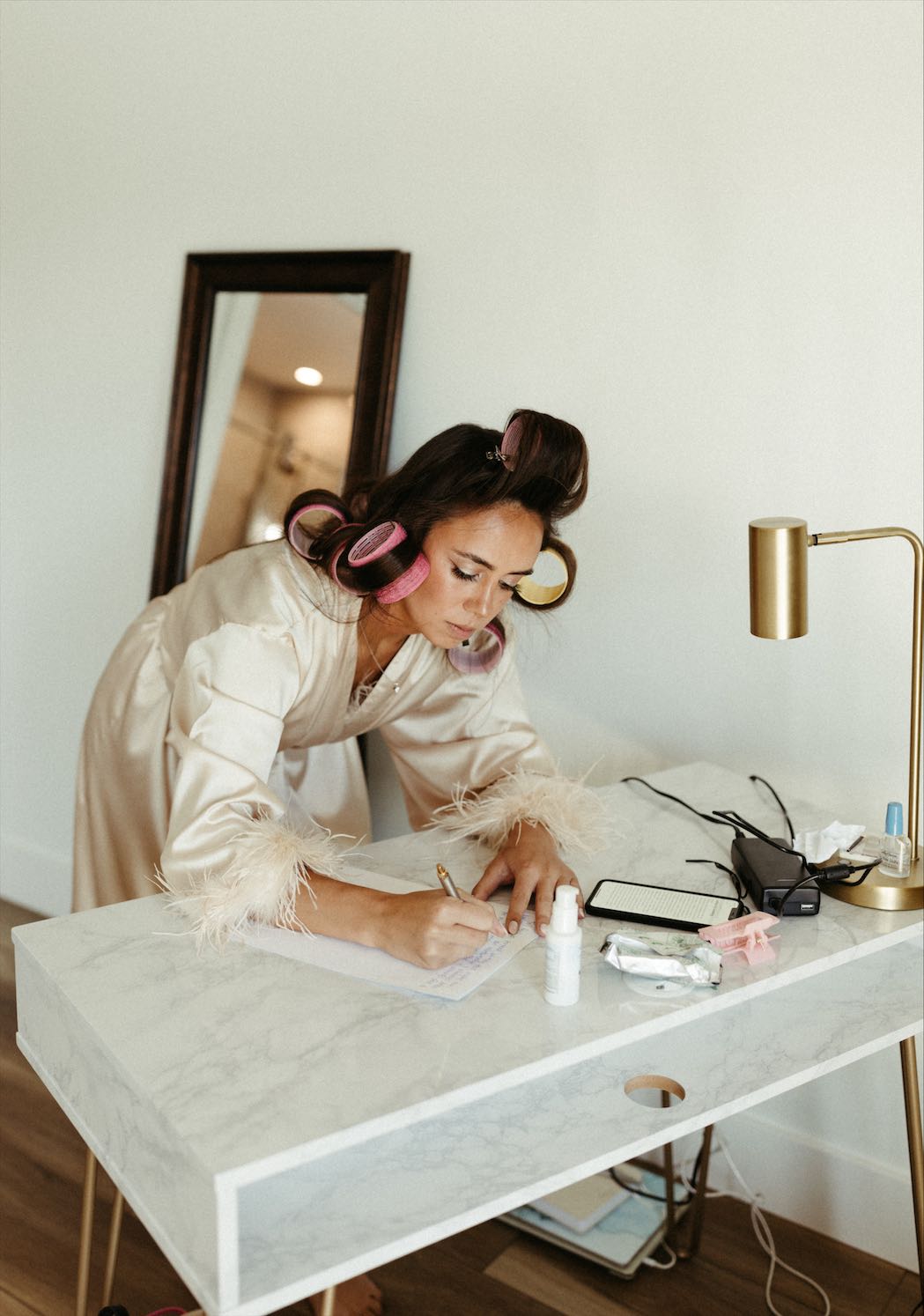 Bride writing a letter to her future husband on her wedding day
