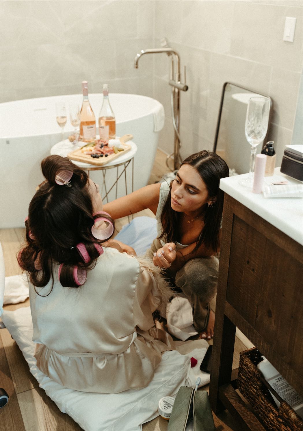 Bride and her sister getting ready for the wedding