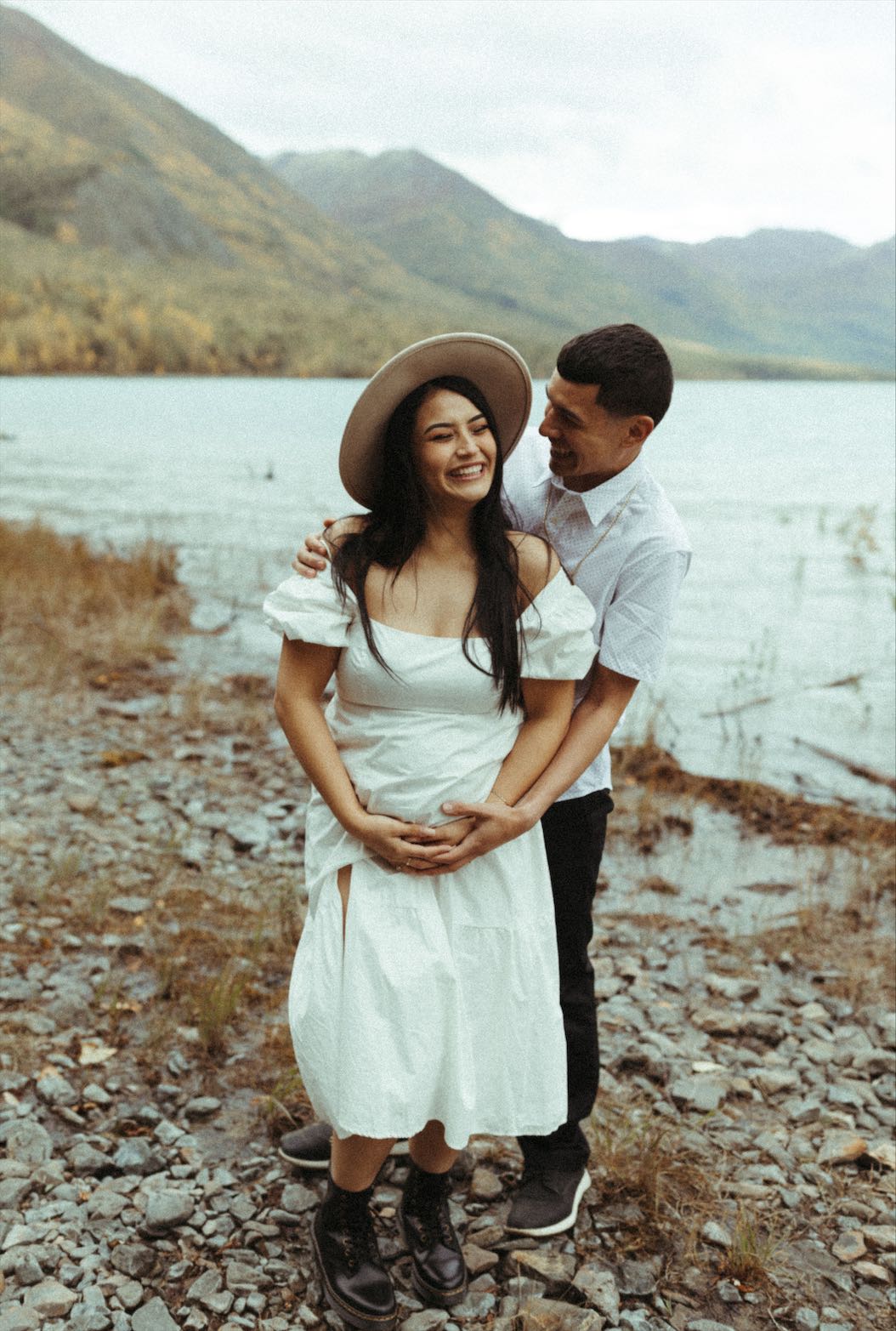 Couple laughing during their session at Eklutna Lake 