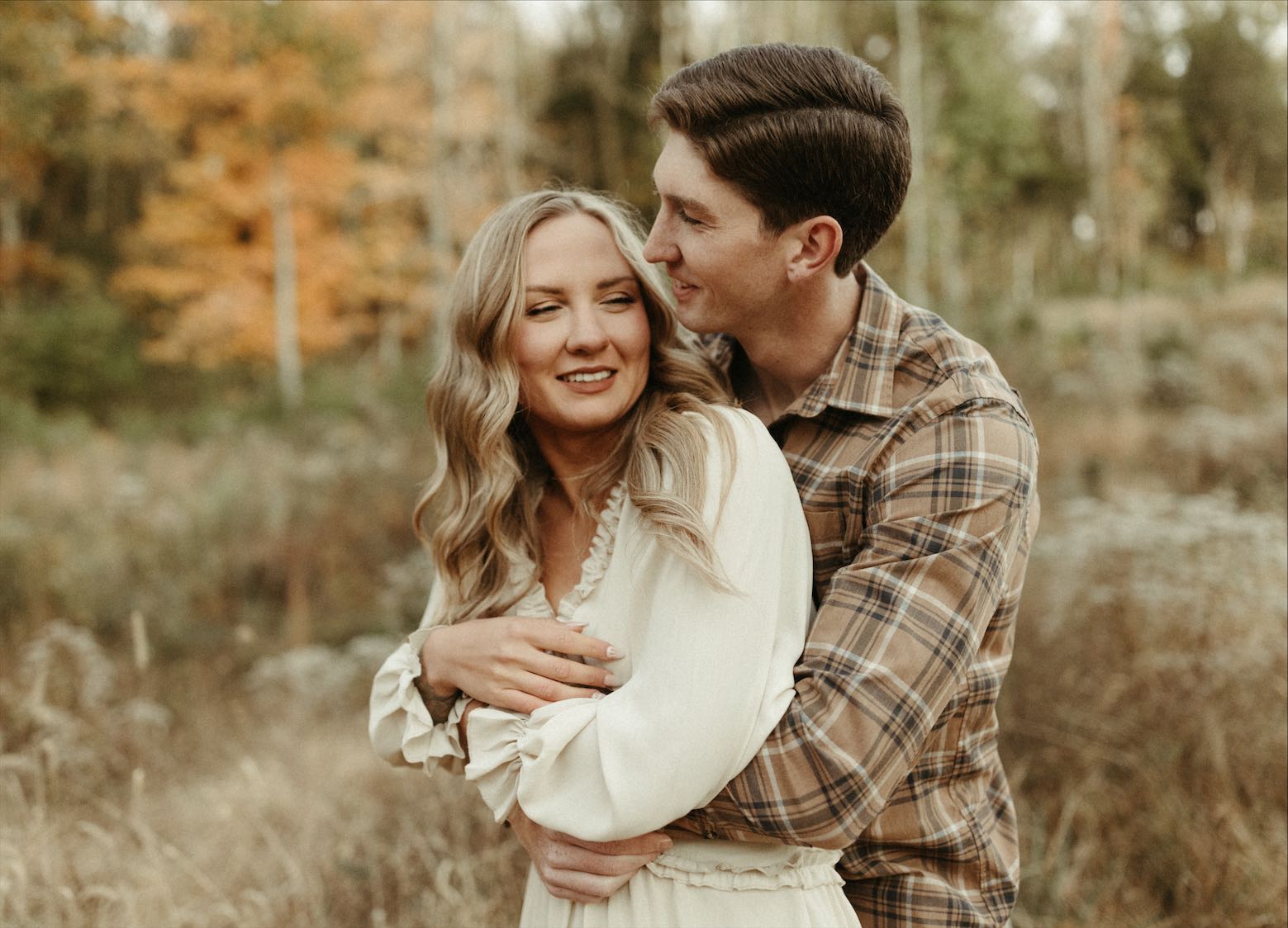 Couple snuggled close during an engagement session in Brentwood, Tennessee