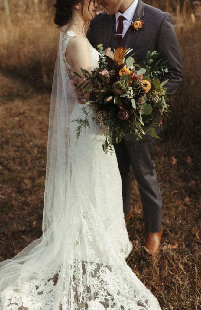 Couple snuggled close during their fall Tennessee wedding 
