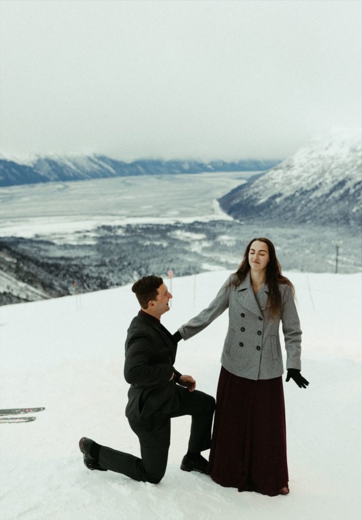 Proposal at a ski resort in Alaska shot by Michelle Johns a wedding photographer