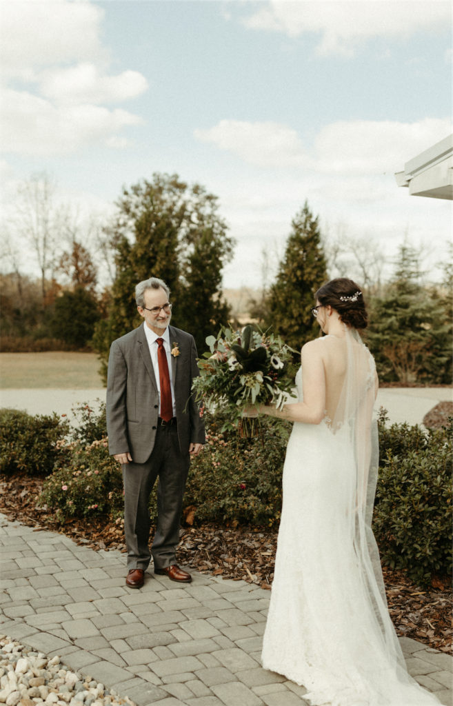 Bride and father seeing one another for the first time