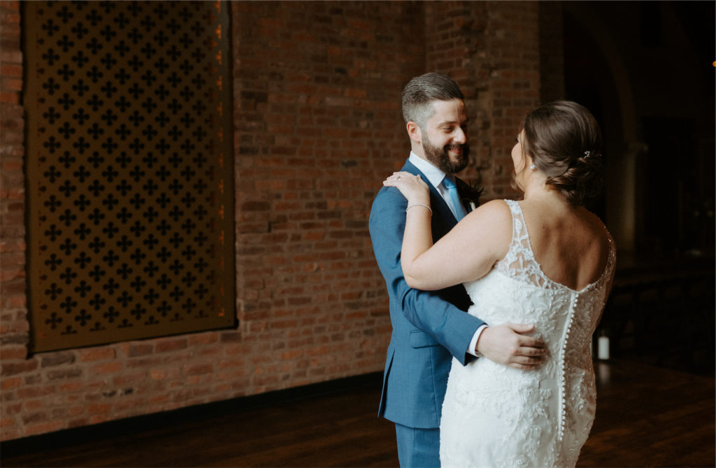 Grooms first look with his bride and he's beaming with joy during their wedding day 