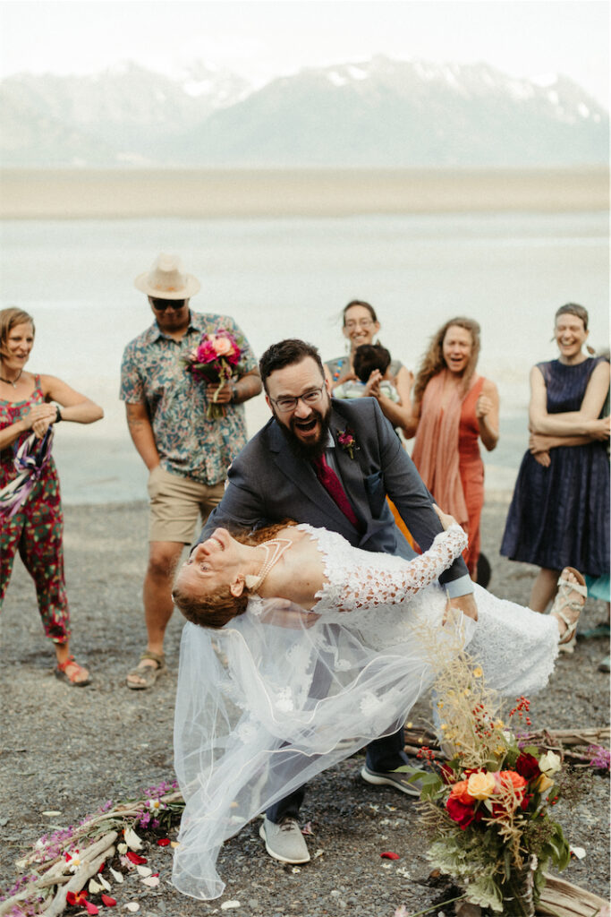 Beach elopement ceremony with friends and family
