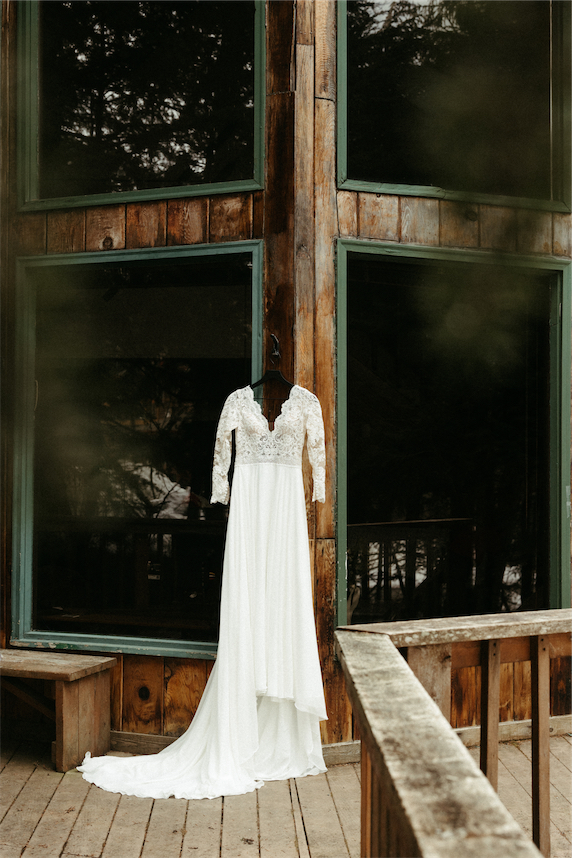 Dress hanging up outside of the couples A frame cabin in Girdwood 