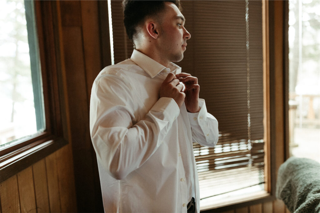 Man getting ready for his and his fiancés alaska elopement in Girdwood 