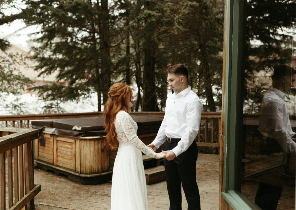 Man and woman seeing one another for the first time during their elopement in Girdwood, Alaska