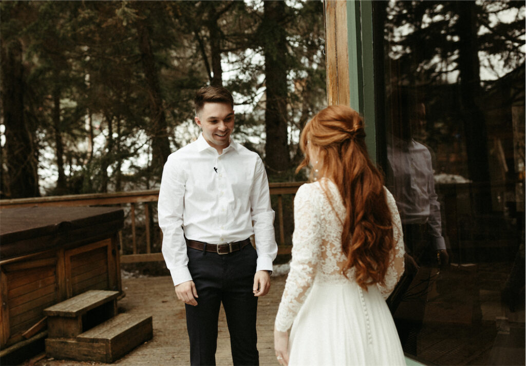 Man seeing his fiancé for the first time during their elopement in Girdwood, Alaska