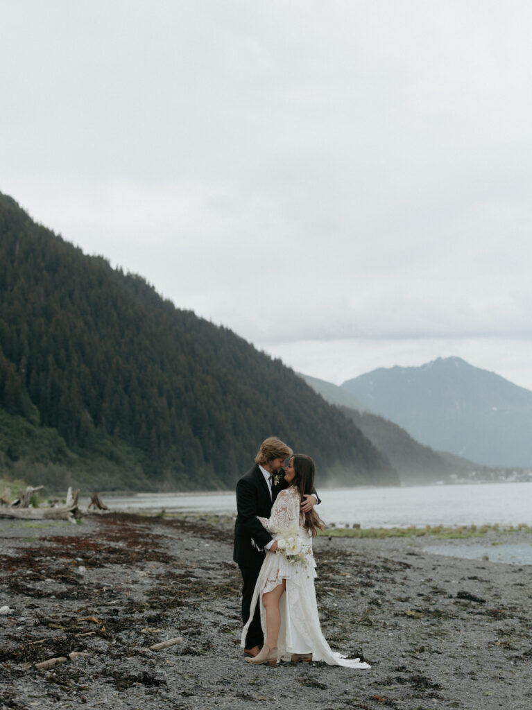 A couple kissing on the beach. 