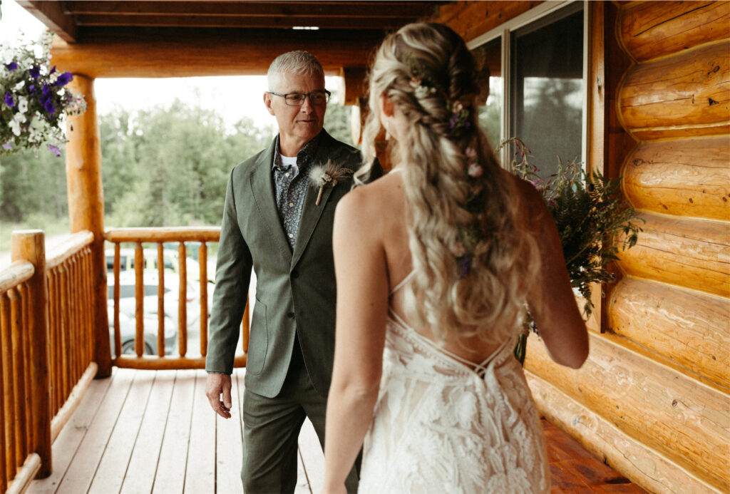 Father of the bride seeing his daughter for the first time on her wedding day