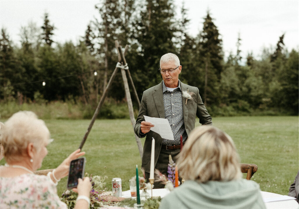 Man reading a speech for wedding toasts in Palmer, Alaska