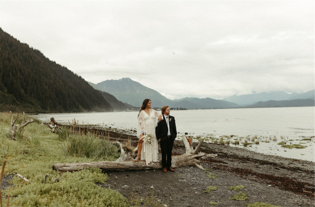 couple standing on the beach after their elopement in Seward, Alaska