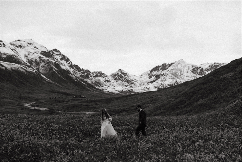 Couple standing among the mountains in Hatchers Pass