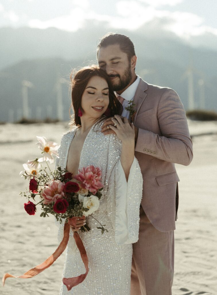couple snuggled close while eloping in California