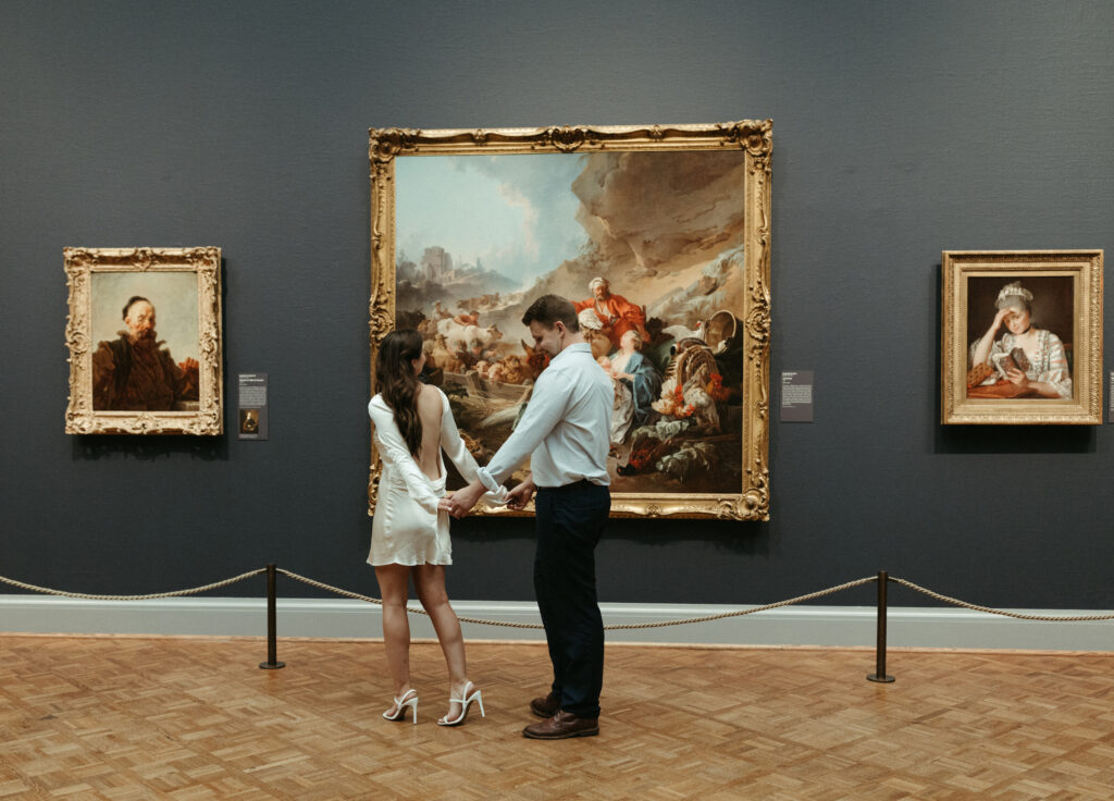 Couple looking at art exhibits in the the art institute of Chicago.