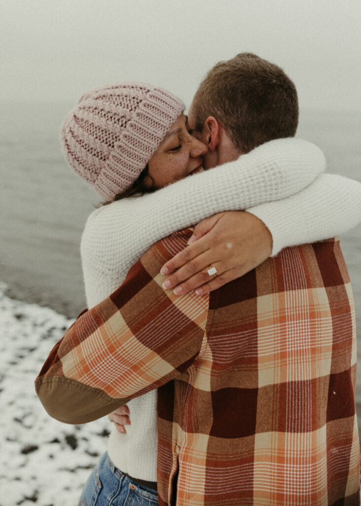 Couple embracing one another after their outdoor proposal photoshoot in Anchorage, Alaska