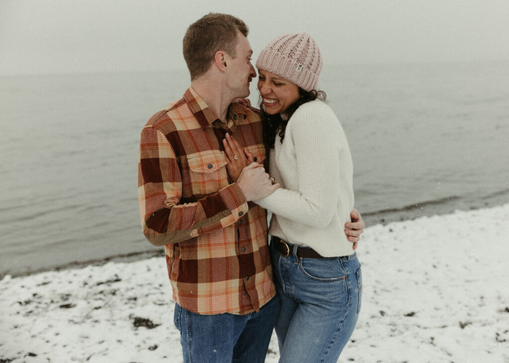 Couple sharing a happy moment together during their engagement session in Alaska