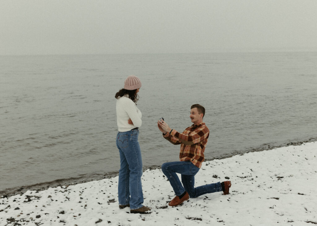 Man down on one knee during an outdoor proposal at Point Woronzof