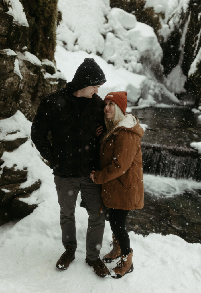 couple taking engagement photos in Alaska