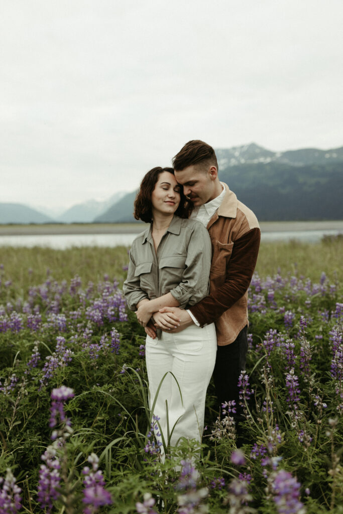 Couple snuggled up close during a photo shoot in Alaska 