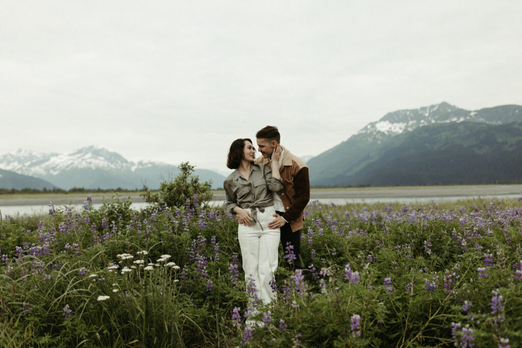 Couple looking at one another during their engagement session in Alaska 