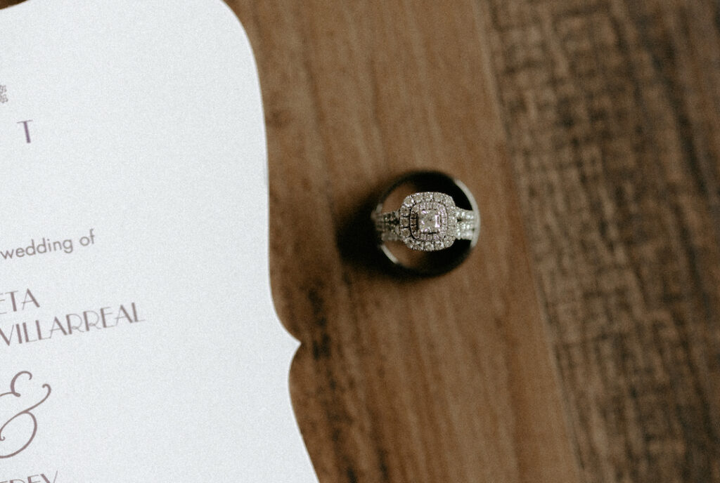 Man and woman's wedding ring sitting on the floor. 