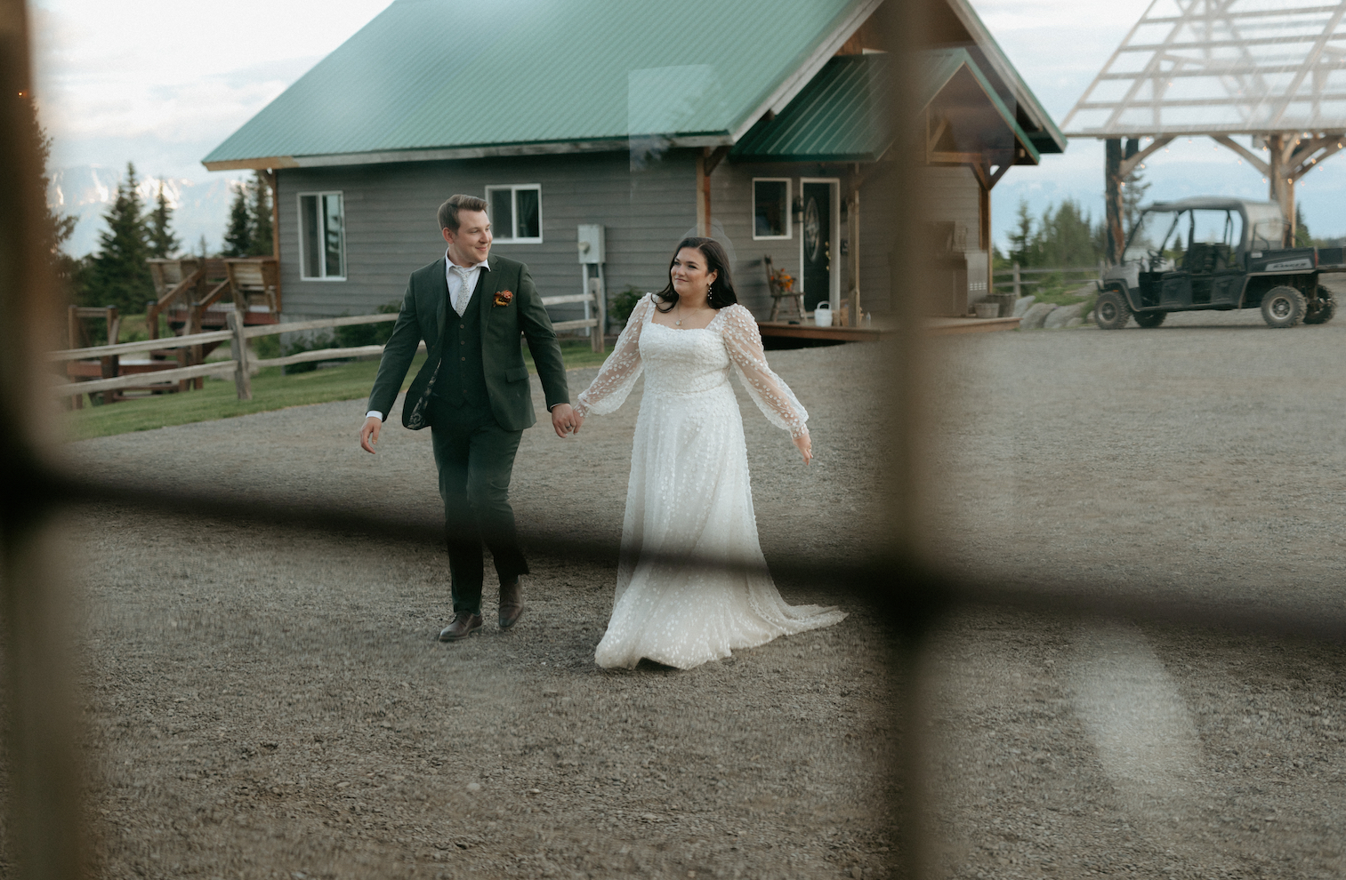 Couple walking in their wedding reception venue in Homer, Alaska.