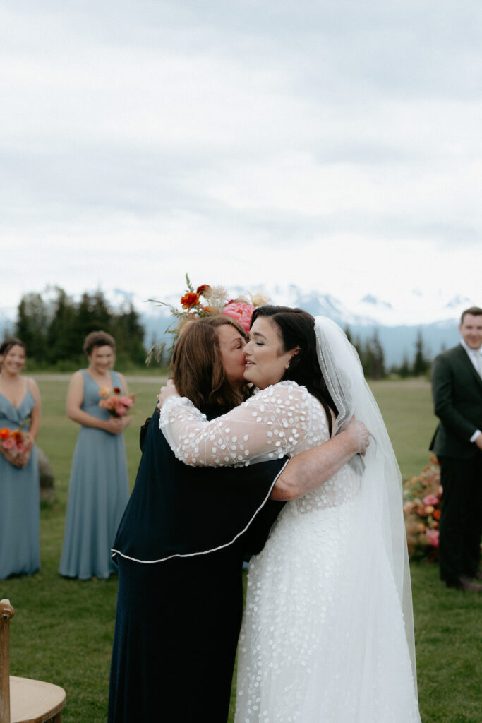 Woman hugging her daughter on her wedding day