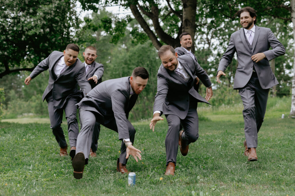 A group of men attempting to grab a beer while racing one another.