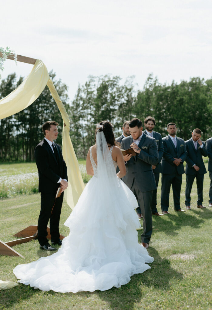 Man reading his wedding vows aloud in Alaska.