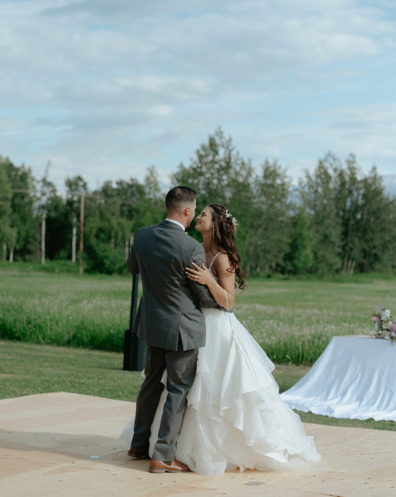 Man and woman sharing their first dance together during their wedding. 